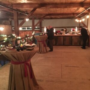 an image of the barn lit up and decorated for the christmas holiday for an event